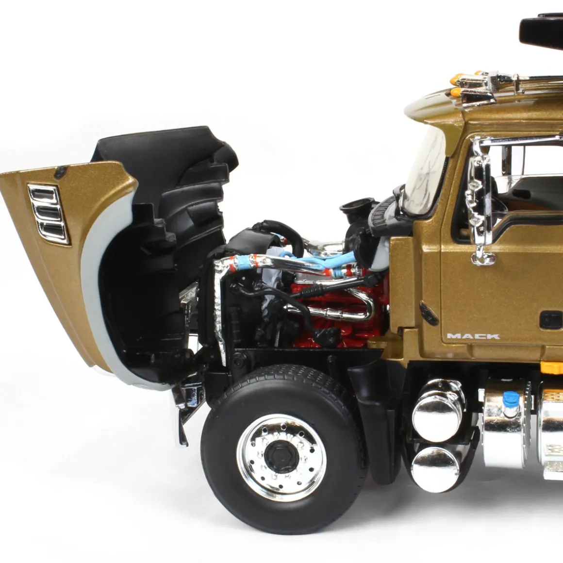 1/34 Gold & Black Mack Granite MP Engine Series Dump Truck by First Gear