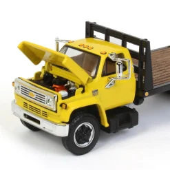 1/64 Yellow Chevy C65 Single Axle Truck with Black Flatbed, DCP by First Gear