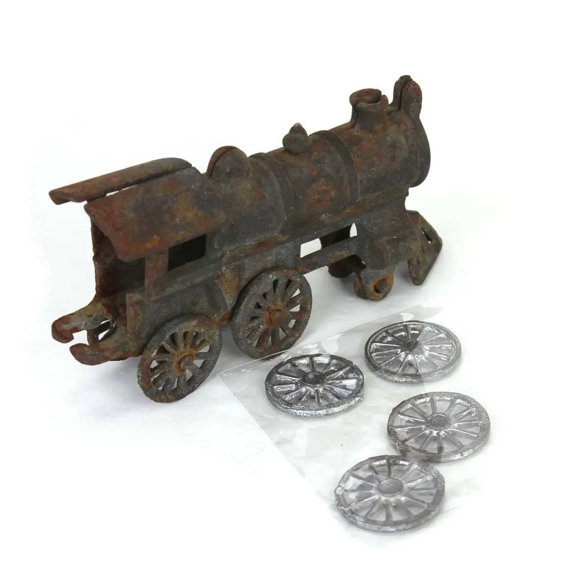Lot of (1) Cast Iron Locomotive and (4) Wheels