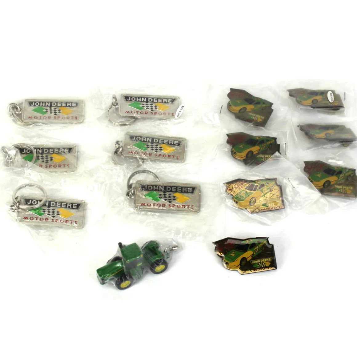 Lot of (7) John Deere Pins, (6) John Deere Motor Sport Key Chains and (1) John Deere 9520 Tractor