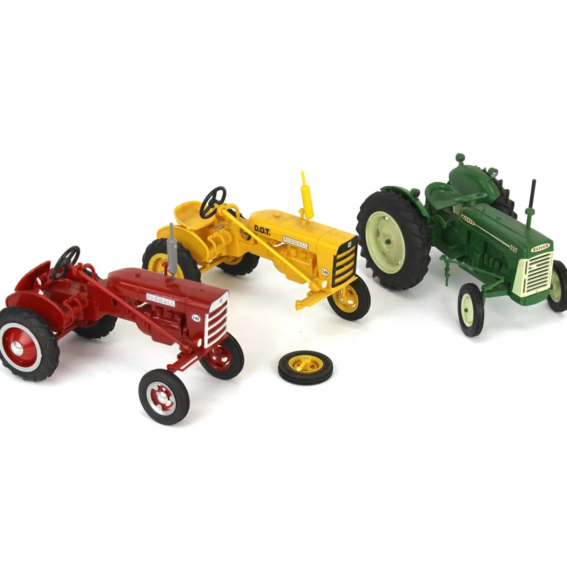 Lot of (2) Plastic Farmall Tractors and (1) Plastic Oliver Tractor